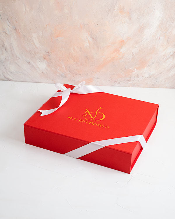 30PCS XMAS Customizable CHOCOLATE BOXChocolate & ConfectioneryYour Gift Contains: • 30 pieces assorted Milk chocolates with message All I want for Xmas is You • Flavors: Pistachio Praline, Rice Crispy, Rocher, Sepculoos, Hazelnut Praline • Box Size: LxBxH