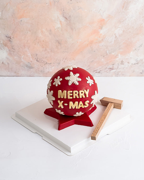 Xmas Piñata BallChocolate & ConfectioneryYour Gift Contains: • Smash ball with 8 chunky Christmas theme assorted chocolates • Flavors: Pistachio, Sepculoos, Hazelnut, Praline, Peanut Butter • Hammer: 1 • Size of Chocolate: 12x12x14cm • Box Size: 20x20x20c