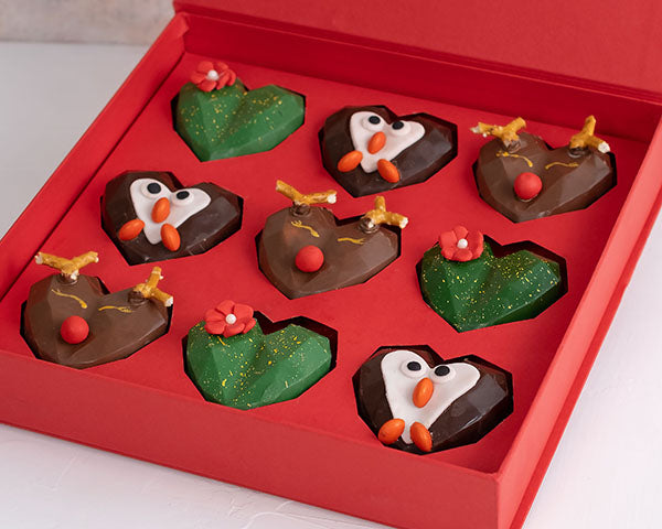 9pcs Assorted Christmas Collection by NJDChocolate & ConfectioneryYour Gift Contains: • 9 assorted Christmas theme chocolates • Flavor: Pistachio, Hazelnut and Roche • Chocolate Milk, Dark and White • Weight of Chocolate: 500grams • Box Size: 24x24x4cm Ha