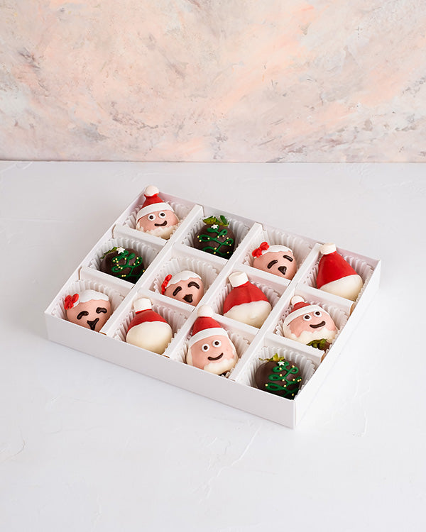 Mr. and Mrs. Santa Clause BerriesChocolate & ConfectioneryYour Gift Contains: • 12 pieces chocolate covered strawberries in Milk and colored chocolate • Box Size: 24x18x3.5cm Handling and Storage • Keep away from direct heat and sunlight • Consume within