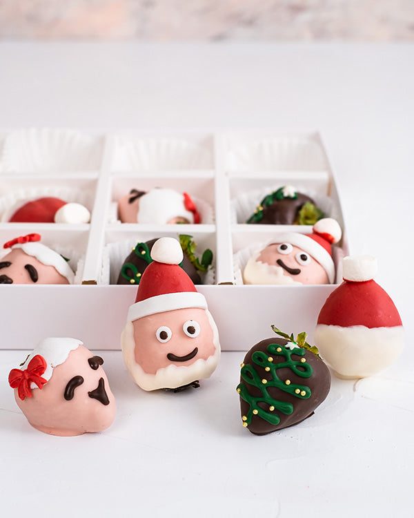 Mr. and Mrs. Santa Clause BerriesChocolate & ConfectioneryYour Gift Contains: • 12 pieces chocolate covered strawberries in Milk and colored chocolate • Box Size: 24x18x3.5cm Handling and Storage • Keep away from direct heat and sunlight • Consume within