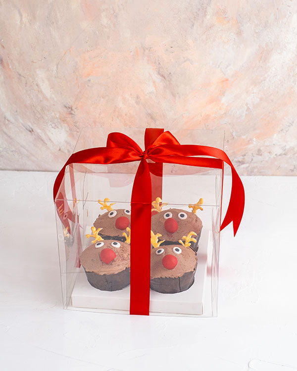 Reindeer Cupcakes by NJDChocolate & ConfectioneryYour Gift Contains: • 4 chocolate flavor cupcakes with Chocolate ganache dressing designed as Reindeer • Box Size: 18x18x14cm Handling and Storage • Keep away from direct heat and sunlight • Best stored bet