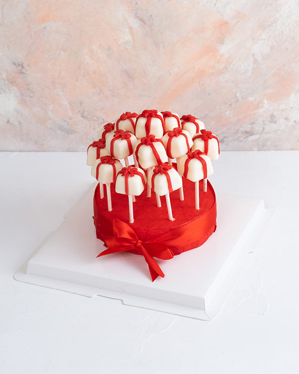 Christmas Cake pops by NJDChocolate & ConfectioneryYour Gift Contains: • 15 pieces cake pops designed as gifts with a bow • Flavors: Chocolate and Red velvet Handling and Storage • Keep away from direct heat and sunlight • Best stored between 12-18 °C • N
