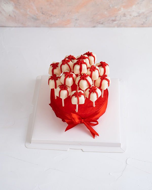 Christmas Cake pops by NJDChocolate & ConfectioneryYour Gift Contains: • 15 pieces cake pops designed as gifts with a bow • Flavors: Chocolate and Red velvet Handling and Storage • Keep away from direct heat and sunlight • Best stored between 12-18 °C • N