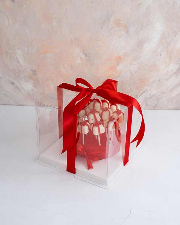 Christmas Cake pops by NJDChocolate & ConfectioneryYour Gift Contains: • 15 pieces cake pops designed as gifts with a bow • Flavors: Chocolate and Red velvet Handling and Storage • Keep away from direct heat and sunlight • Best stored between 12-18 °C • N
