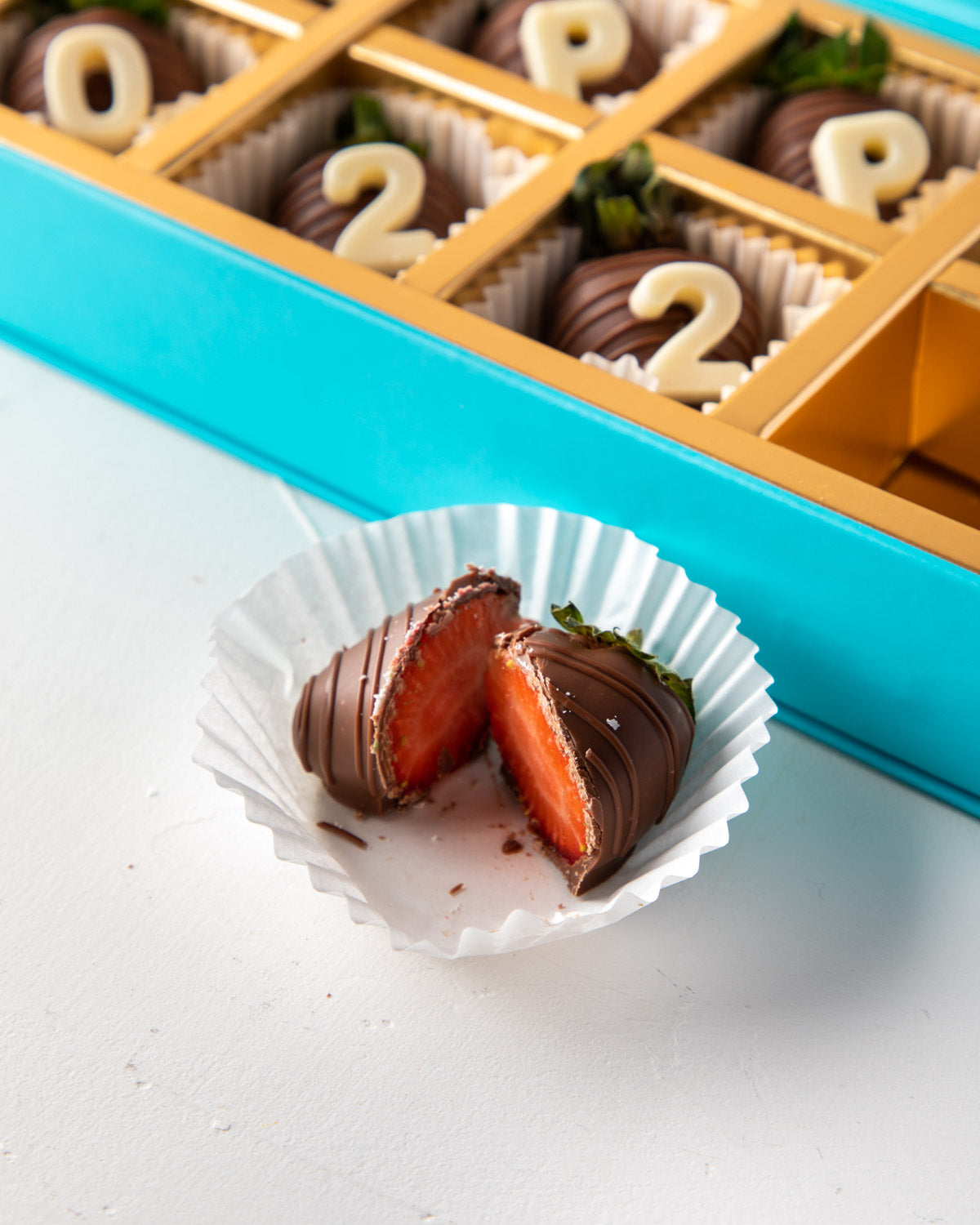 Happy 2022 Chocolate Strawberries by NJDChocolate & ConfectioneryYour Gift Contains: • 10 pieces Milk chocolate covered strawberries with "Happy 2022" message Box Size: LxBxH: 25x12x4cm HANDLING AND STORAGE Keep away from direct heat and sunlight Best sto