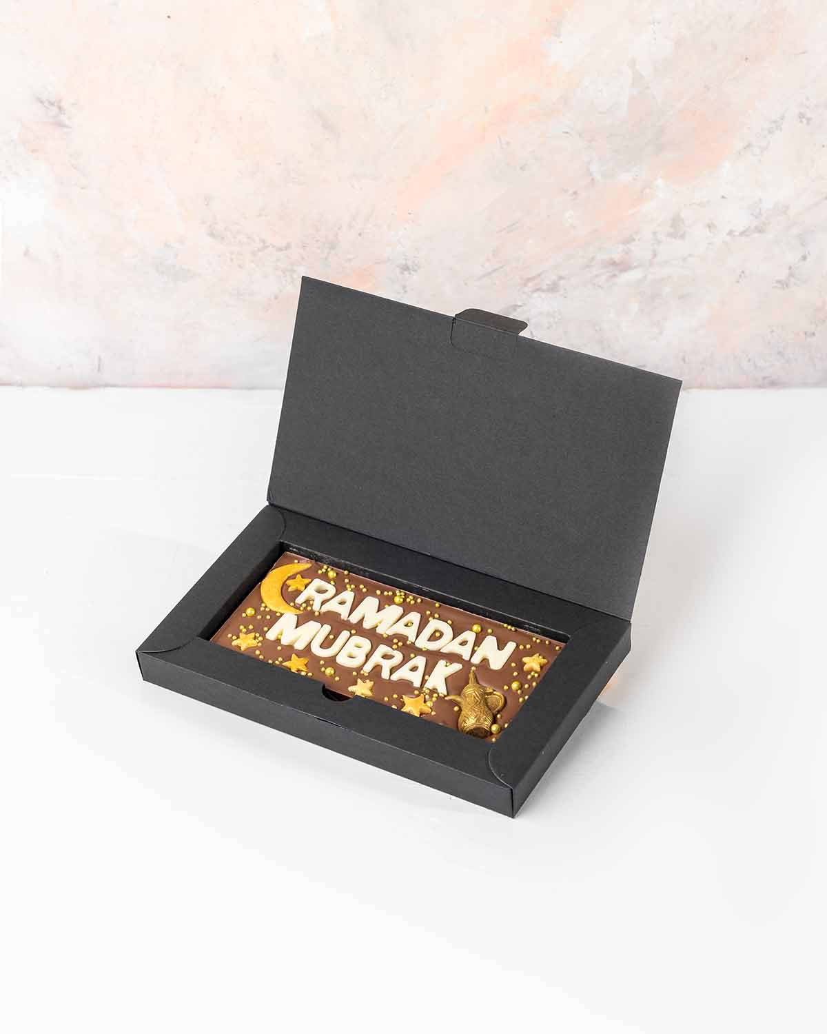 Ramadan Mubarak Chocolate Bar by NJDChocolate & ConfectioneryYour Gift Contains:• Ramadan Theme bar• Chocolate Weight: 140grams• Chocolate Size: 14.5x6.5cmx1cm• Box Size: 19x11x2cmHandling and Storage • Keep away from direct heat and sunlight• Best stored
