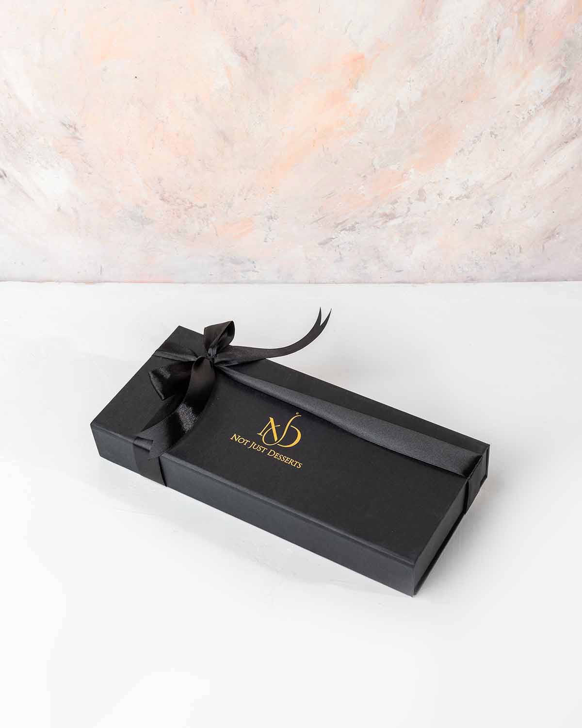 10 Assorted Dates Pack by NJDChocolate & ConfectioneryYour Gift Contains:• 10 x Belgian milk chocolate coated dates• Flavors: Roasted Pistachio, Milk chocolate Rose, Roasted Almonds• Box Size: 28x12x4cmHandling and Storage • Keep away from direct heat and