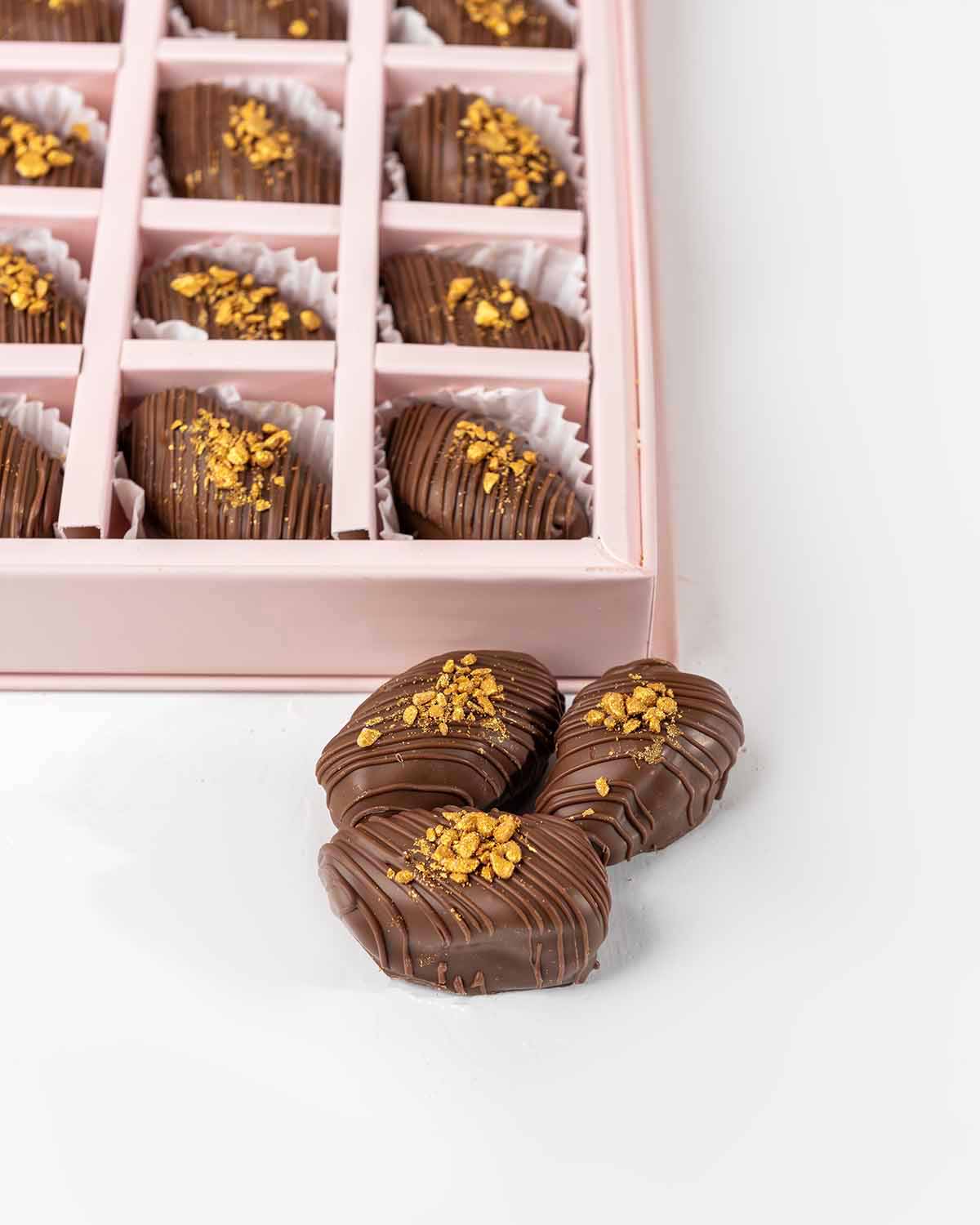 30 Chocolate Covered Dates by NJDChocolate & ConfectioneryYour Gift Contains:• 30 x Belgian Milk Chocolate covered Premium Majdoul dates • Box Size: 31x26x3.5cmHandling and Storage • Keep away from direct heat and sunlight• Best stored between 12-18 °C• S