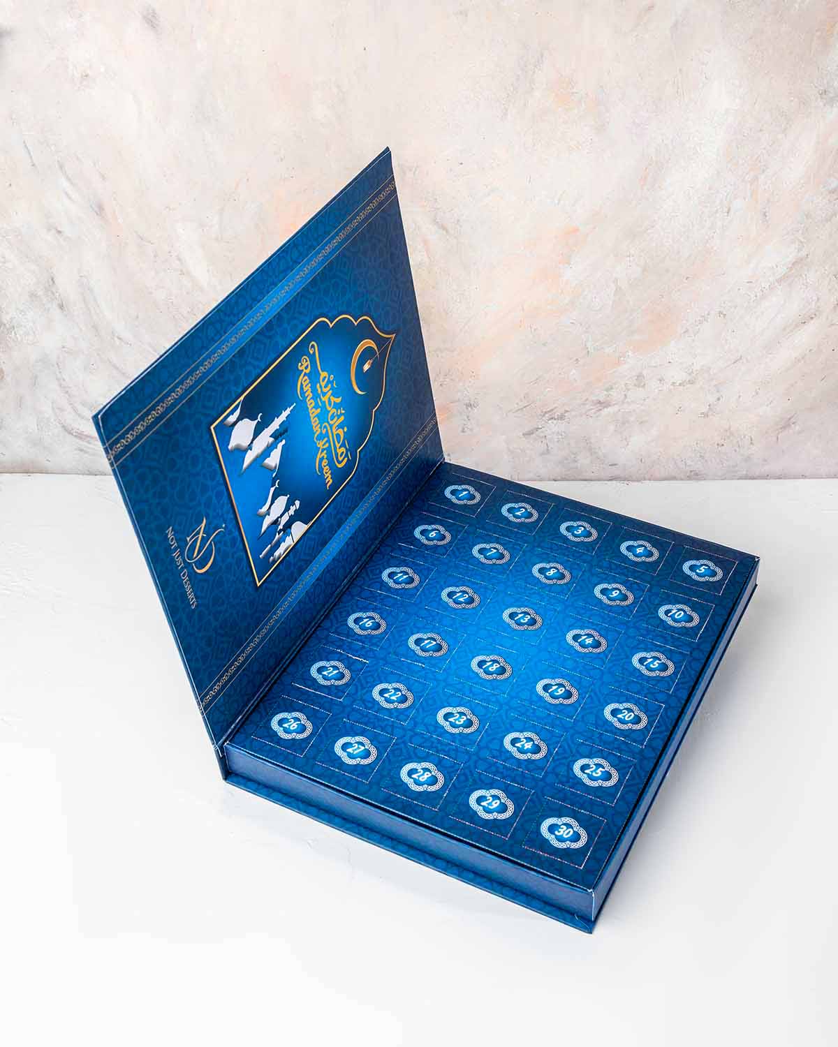 Ramadan Advent Calendar by NJDChocolate & ConfectioneryYour Gift Contains:• 15 x Chocolate covered dates with roasted nuts• 15 x Assorted Milk Chocolates• Chocolate Flavors: Pistachio, Hazelnut, Speculoos, Peanut Butter, Roche and Speculoos • Chocolate We