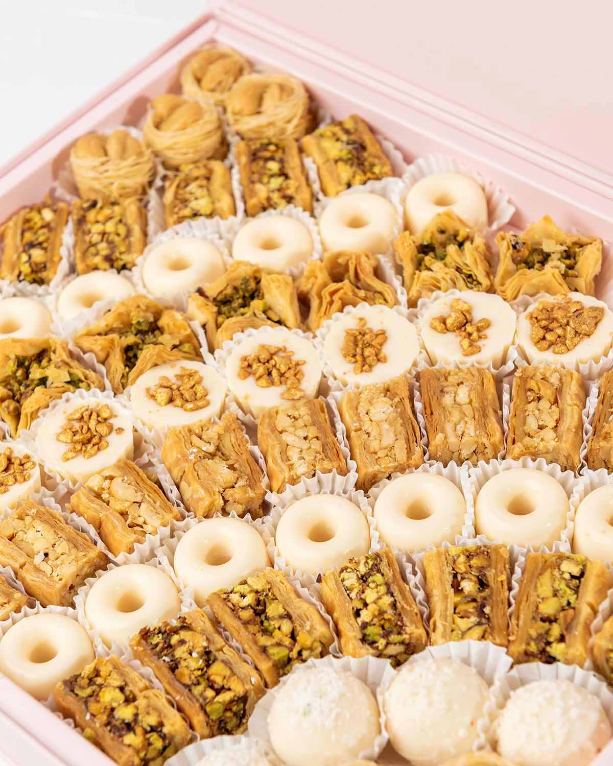 Baklawa and Chocolates Gift Box by NJDChocolate & ConfectioneryYour Gift Contains:• 7 x Bul Bul Cashew Baklawa• 4 x White chocolate assorted truffles • 12 x Assieh Pistachio• 11 x Assieh Cashew• 28 x Assorted White chocolates• 8 x Bookaj Pistachio• Flavor