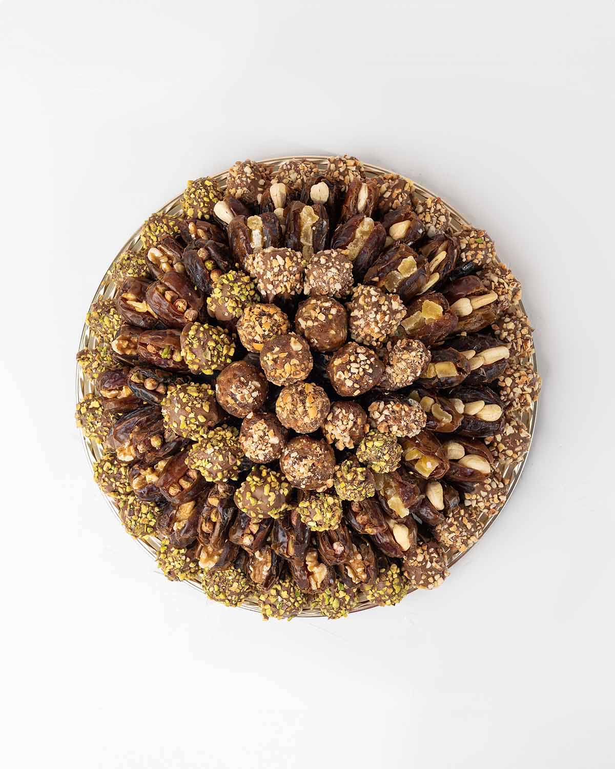 1200gms Dates Hamper by NJDChocolate & ConfectioneryYour Gift Contains:• 9 x Energy Balls with roasted Nuts• 9 x Premium Majdoul Dates with Dried mango filling• 11 x Majdoul Dates with Roasted salted Pistachio• 12 x Majdoul Dates with Roasted salted Cashe