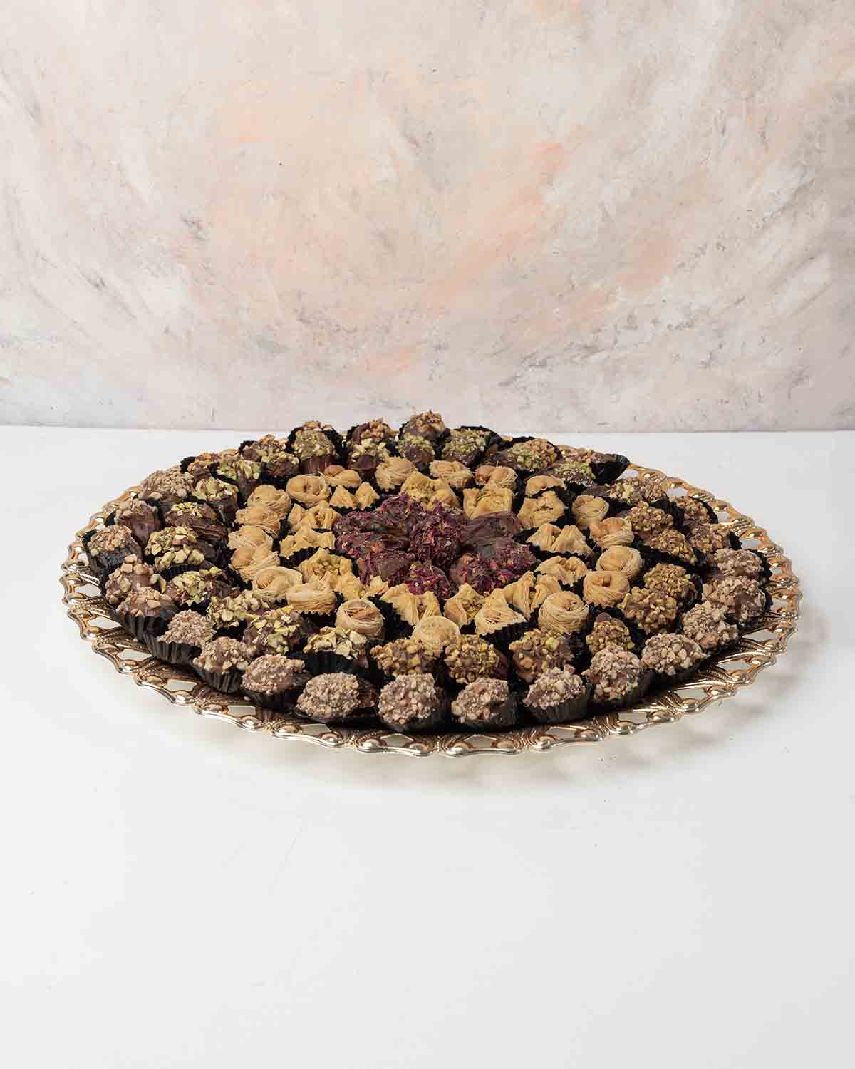 Large Dates and Baklawa Arrangement by NJDChocolate & ConfectioneryYour Gift Contains:• 28 x Chocolate Covered Dates with roasted Pistachio• 25 x Chocolate Covered Dates with roasted Almond• 10 x Chocolate Covered Dates with Rose flavor• 13 x Bookaj Pista