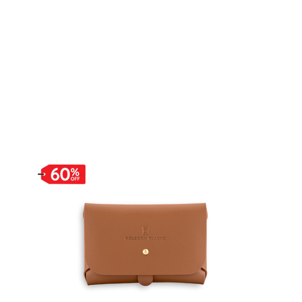 Leatherbound Strapped WalletFashion AccessoriesKeep your cash and cards secure with our stylish Leatherbound Strapped Wallet made from premium vegan leather. Featuring a convenient buttoned closure, this wallet is both practical and fashionable. Perfect f