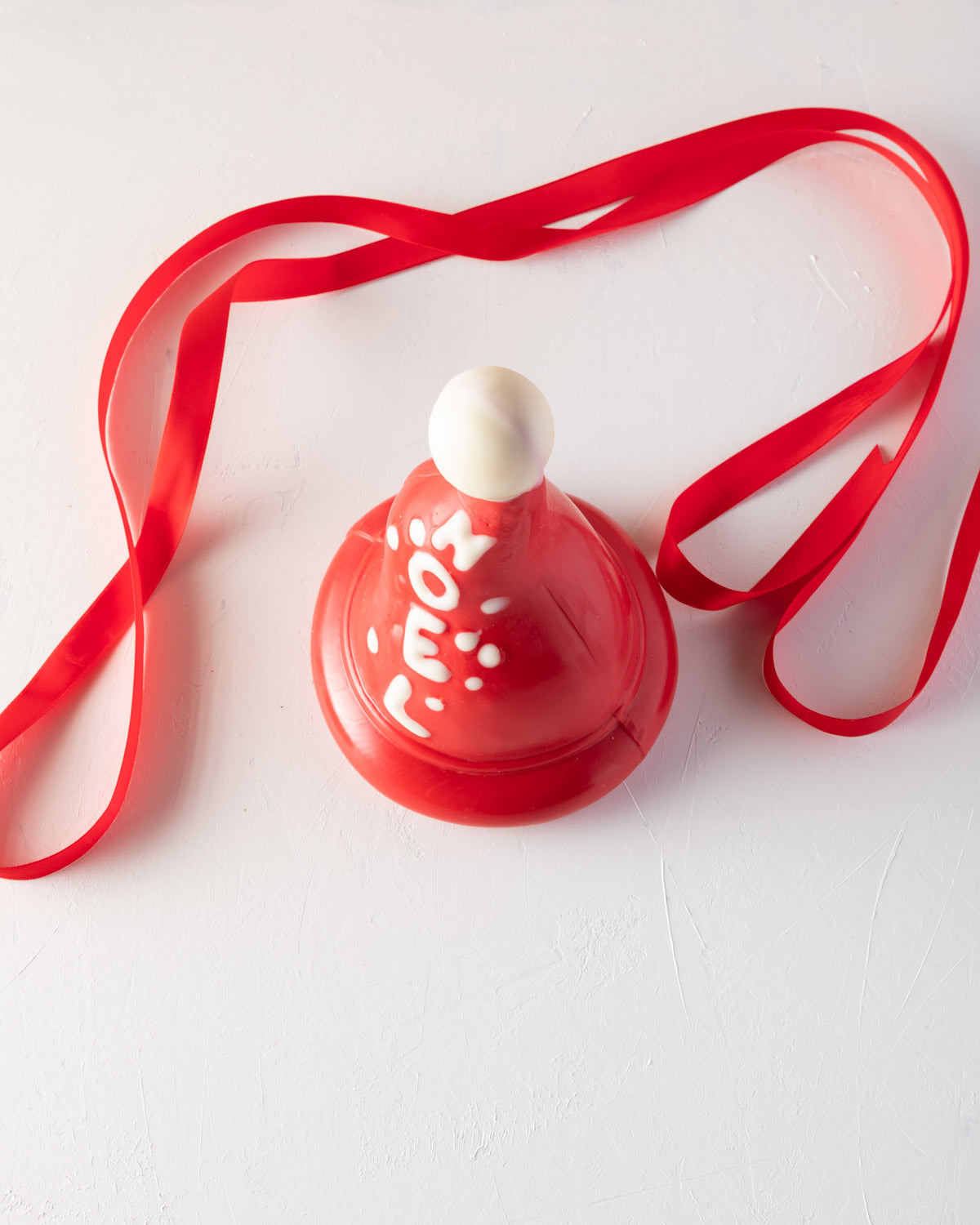 Edible Santa hat by NJDChocolate & ConfectioneryYOUR GIFT CONTAINS Christmas tree, inspired by the shape of a Christmas hat made with approx 500gms pure Belgian milk and colored chocolate making it a great Christmas gift Chocolate Dimensions: LxBxH: 13x13