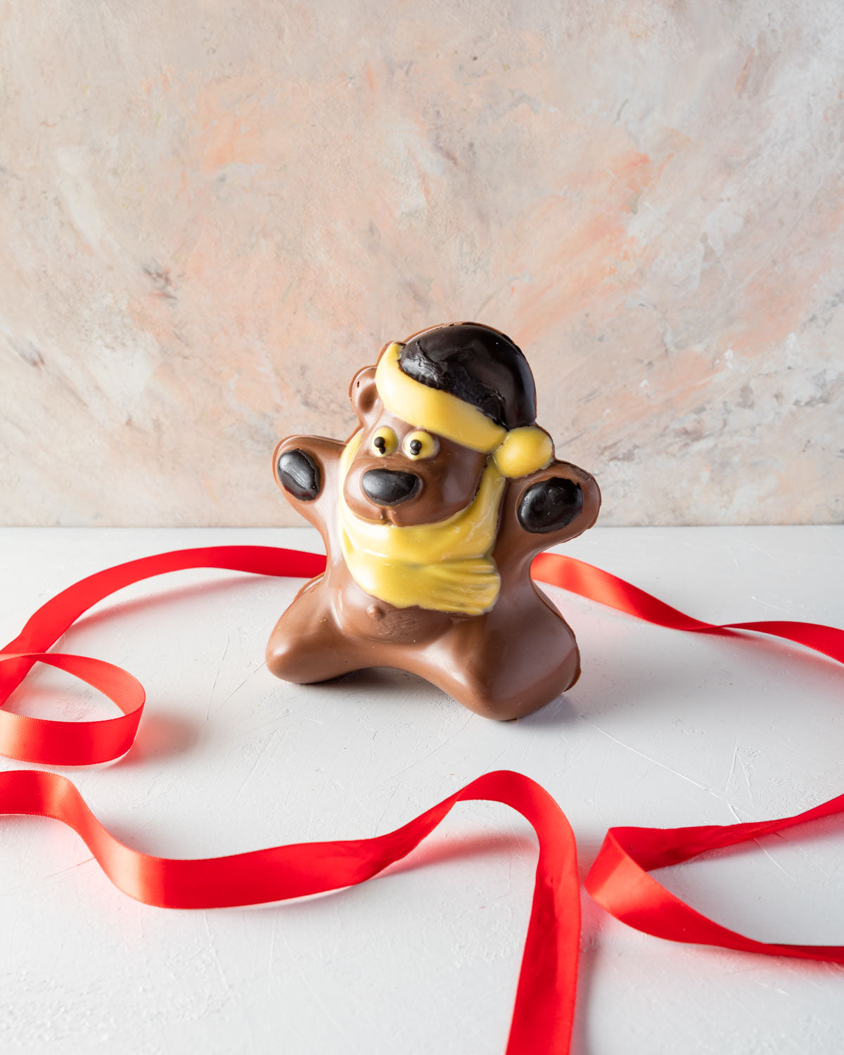 Chocolate Bear by NJDChocolate & ConfectioneryYOUR GIFT CONTAINS A happy and fun Christmas teddy made with approx 450gms of milk, white and dark chocolate Chocolate Dimensions: LxBxH: 12x12.5x15cm Flavors: Pure Belgian Milk chocolate and Color chocolate B