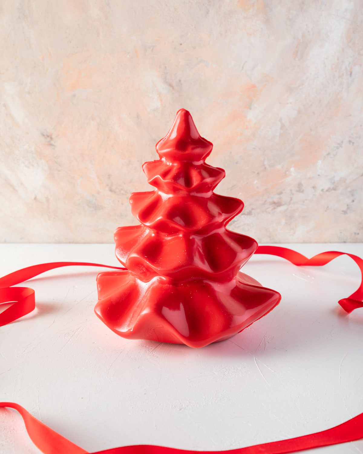 Tutu Edible Xmas Tree by NJDChocolate & ConfectioneryYOUR GIFT CONTAINS An elegant and shining Christmas Tree made with milk and colored chocolate weighing approx 750gms Chocolate Dimensions: LxBxH: 17x17x20cm Flavors: Pure Belgian Milk chocolate and Colo