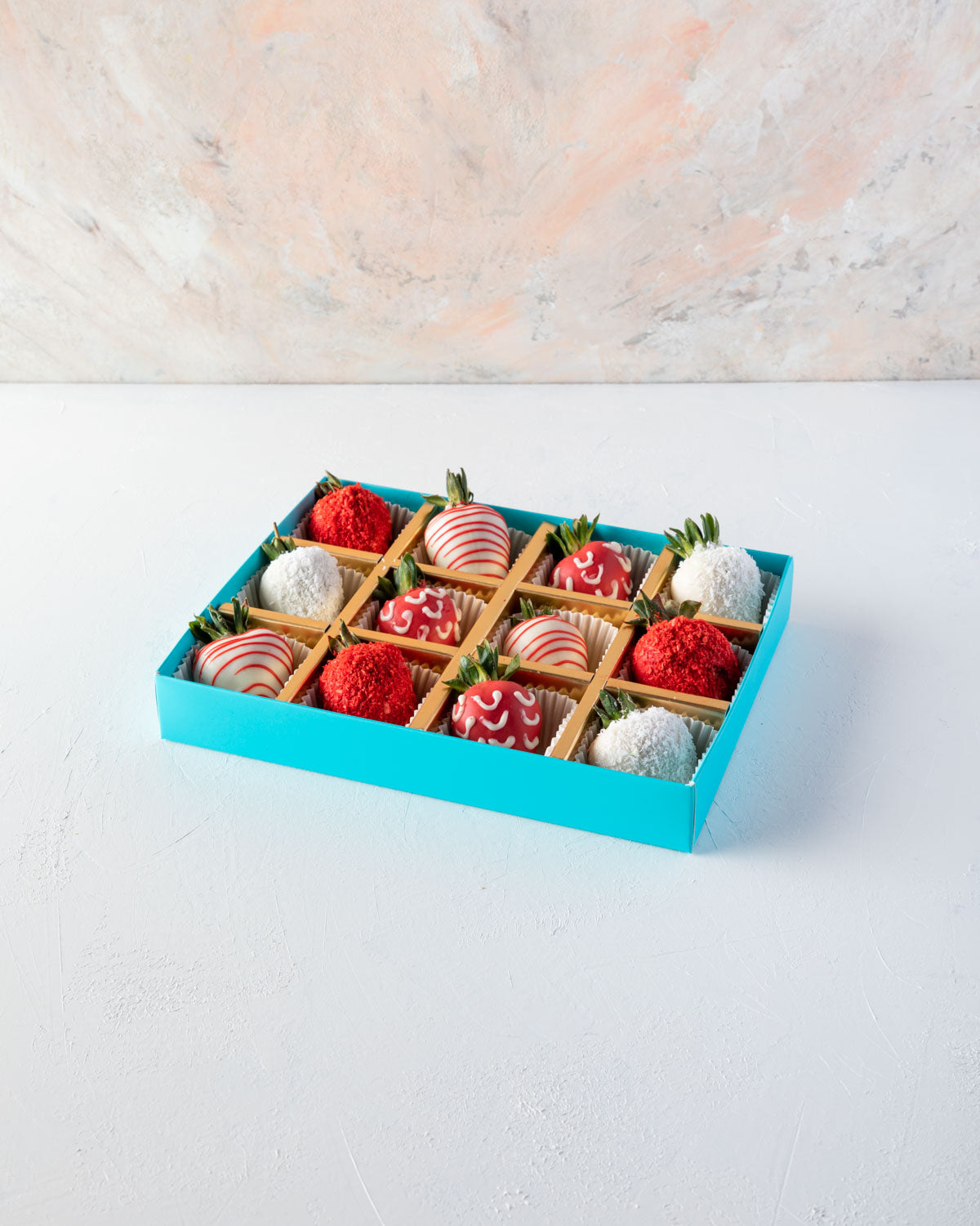 12pcs Red and White Strawberries by NJDChocolate & ConfectioneryYOUR GIFT CONTAINS 12pcs of strawberries covered in pure Belgian rich Milk chocolate sprinkled with edible glitters Flavors: White and colored chocolate, fresh strawberries Box dimensions: Lx