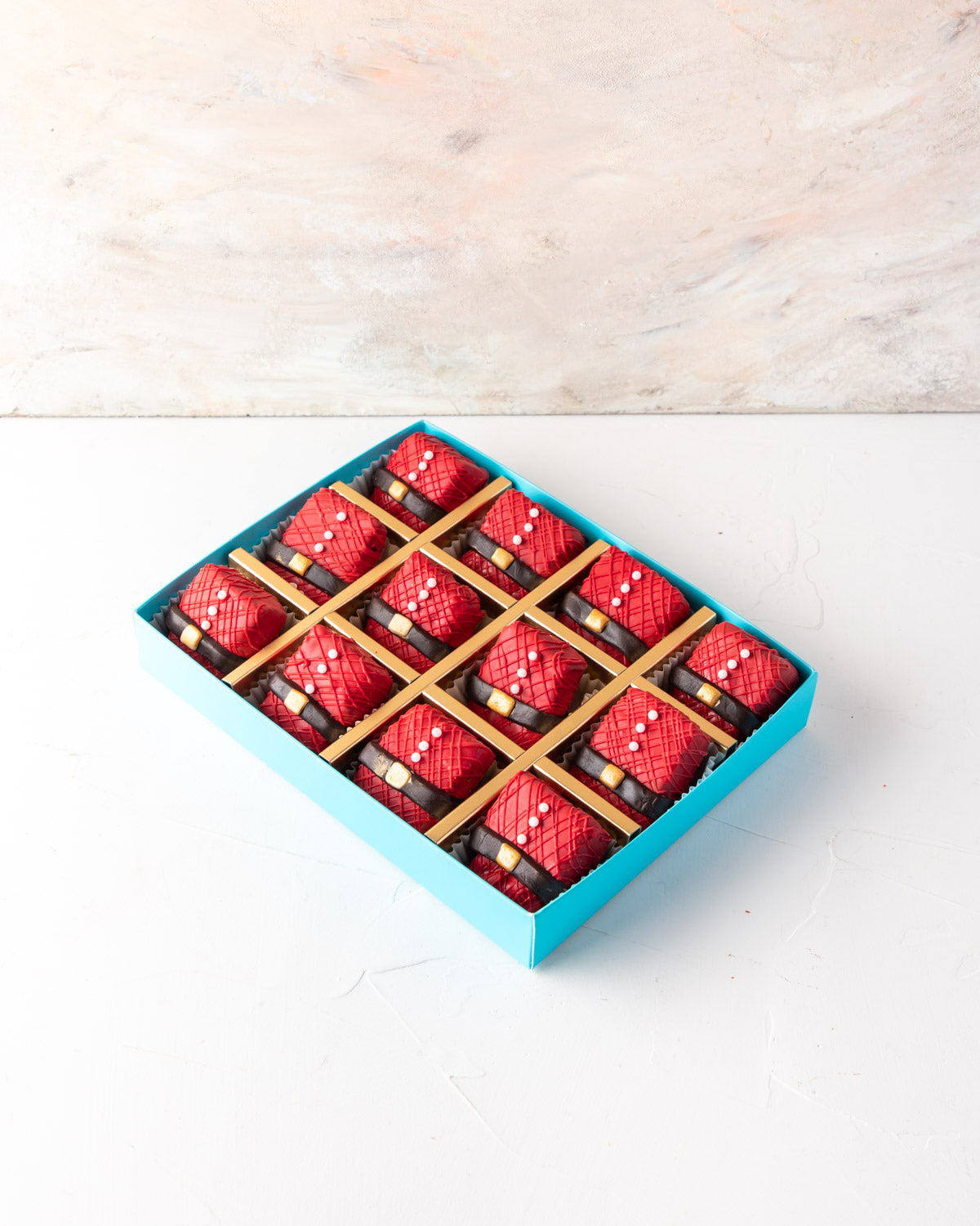 Santa 's Favorite Rice Krispies by NJDChocolate & ConfectioneryYour Gift Contains: • 12 pieces Santa Clause Rice Krispies treat designed in Colored and dark chocolate Box Size: LxBxH: 24x18x4cm HANDLING AND STORAGE Keep away from direct heat and sunlight