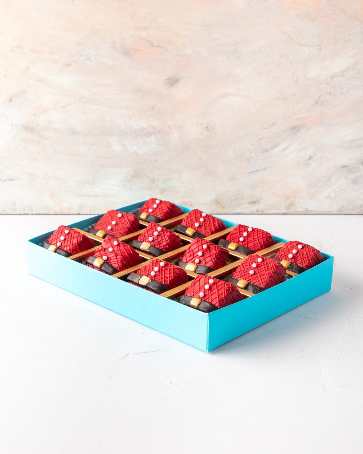 Santa 's Favorite Rice Krispies by NJDChocolate & ConfectioneryYour Gift Contains: • 12 pieces Santa Clause Rice Krispies treat designed in Colored and dark chocolate Box Size: LxBxH: 24x18x4cm HANDLING AND STORAGE Keep away from direct heat and sunlight