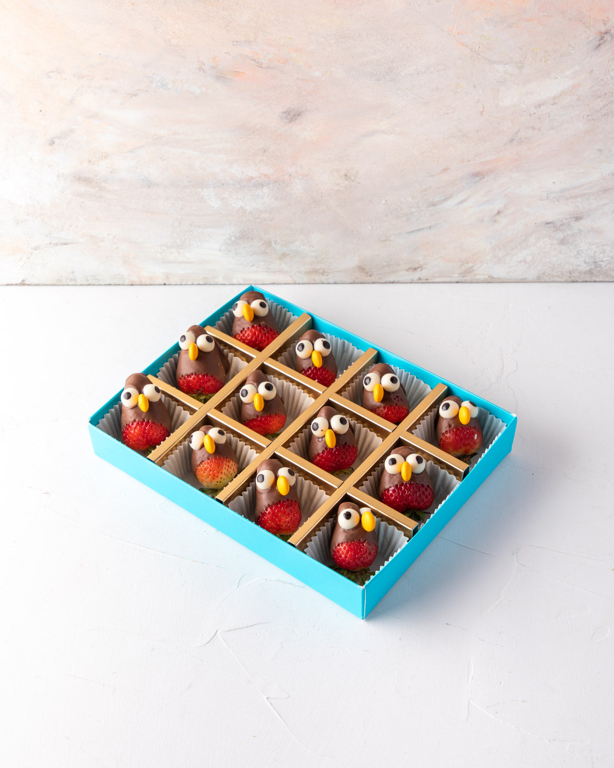Chocolate Strawberry PenguinsChocolate & ConfectioneryYour Gift Contains: • 12 pieces chocolate covered strawberries designed as penguins • Contains candies, dark and milk chocolate in small percentage Box Size: LxBxH: 24x18x4cm HANDLING AND STORAGE Keep