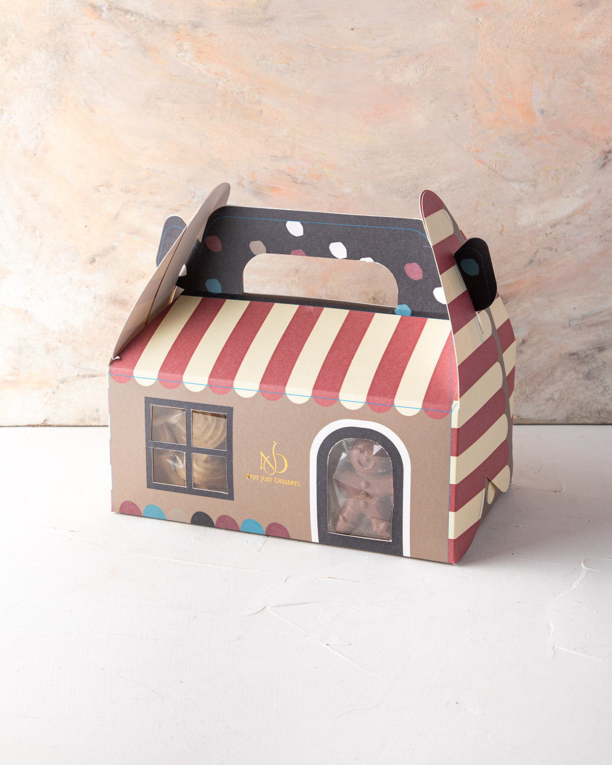 Christmas Treat box by NJDChocolate & ConfectioneryYour Gift Contains: • 1 pack freshly baked cookies • 1 hot chocolate bomb • 1 pack milk and dark chocolate covered Oreos • 1 pack milk chocolate ginger man • 1 pack chocolate brownie bites • 1 pack Christ