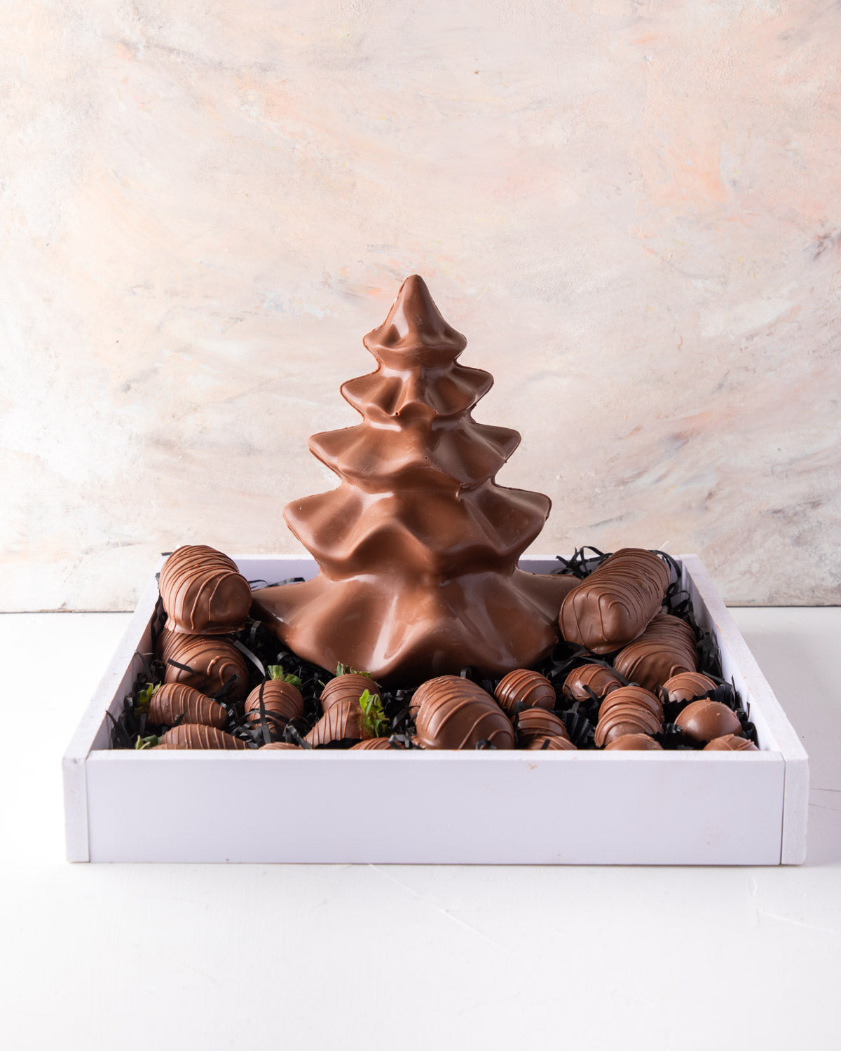 Christmas Assortment by NJDChocolate & ConfectioneryYour Gift Contains: • Tutu Edible Xmas Tree made with Milk chocolate - approx. weight 500gms • 5 sticks of Milk chocolate covered Marshmallows • 10 pieces Milk chocolate covered strawberries • 10 pieces