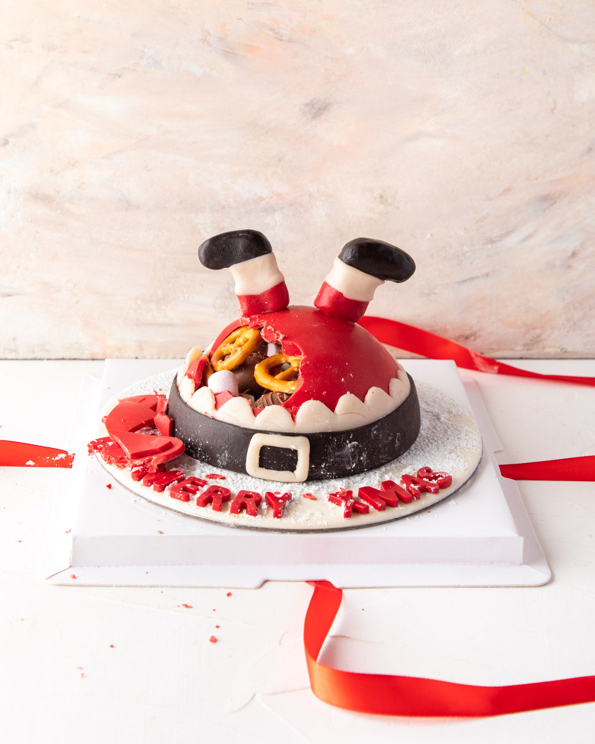 Where's the Santa by NJDChocolate & ConfectioneryYour Gift Contains: • Made with approx. 500gms (10gms +/-) chocolate • Filled with Pretzels, Christmas theme Milk chocolates • Personalized text: up to 15 characters Box Size: LxBxH: 23x23x18cm HANDLING AND