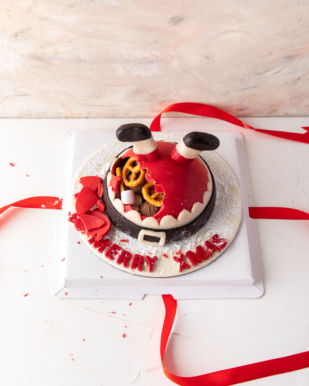 Where's the Santa by NJDChocolate & ConfectioneryYour Gift Contains: • Made with approx. 500gms (10gms +/-) chocolate • Filled with Pretzels, Christmas theme Milk chocolates • Personalized text: up to 15 characters Box Size: LxBxH: 23x23x18cm HANDLING AND