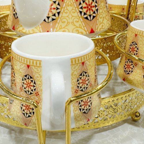 Luxury Ceramic Tea & Coffee Set with Gold Metal Stand | Elegant Multi-Design Jug & CupsKitchen StorageThis luxurious ceramic tea & coffee set exudes elegance with its gold metal stand and multi-design jug & cups. Enjoy a stylish and sophisticated tea or c