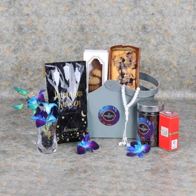 Bag of Wishes Ramadan HamperGifts and HampersHamper Includes: Swiss Rabia Oud Oil 1 Prayer Beads Assorted Color Madjool Dates in Assorted Ramadan Kareem Pouch 100gm Dates Mamoul 5 Pcs Blueberry Loaf Cake Dried Cranberries in a Jar 200gm 1 Karak Tea Cup Ar