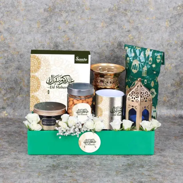 Blissful Eid Hamper GreenGifts and HampersHamper Includes: Assorted Stuffed Dates Box 16 Pcs By Sweecho 1 Swiss Arabia Bakhoor 1 Bakhoor Burner Assorted Sweecho Chocolates in Ramadan Kareem Pouch 100gm Arabic Coffee 100gm 1 Ramadan Kareem Coffee Mug Chill