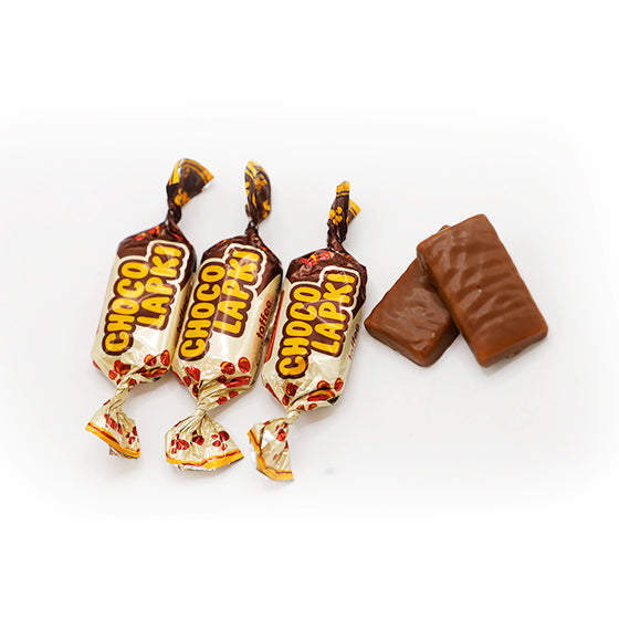 Choco LapkiChocolate & ConfectionerySugar, glucose syrup, vegetable oils (palm oil, fully hydrogenated olive kernel oil), condensed milk product [condensed skimmed milk, sugar, olive oil, lactose], whey filtrate powder (milk), chopped roasted peanuts Coun