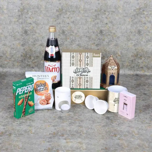 Eid Together Gift HamperGifts and HampersGift Includes: Assorted Stuffed Dates Box 16 Pcs By SweechoÊ 1 Aroma Oil 1 Oil Burner with Tlight Candle 1 Vimto Fruit Cordial 710ml Lotte Pepero Almond and Chocolate Sticks 32gm Hunters Gourmet Baked Pretzos 70gm