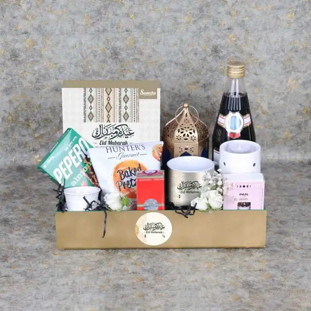 Eid Together Gift HamperGifts and HampersGift Includes: Assorted Stuffed Dates Box 16 Pcs By SweechoÊ 1 Aroma Oil 1 Oil Burner with Tlight Candle 1 Vimto Fruit Cordial 710ml Lotte Pepero Almond and Chocolate Sticks 32gm Hunters Gourmet Baked Pretzos 70gm