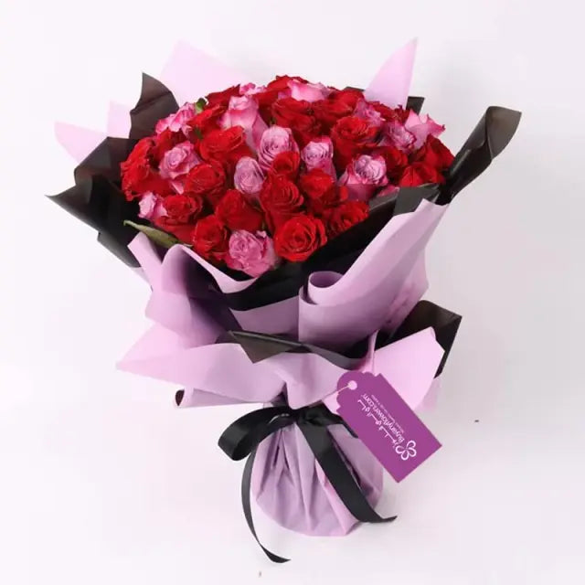 For My Queen Bouquet and Ferrero Rocher 200gmChocolate & Confectionery200gm Ferrero Rocher 31 Red Roses 20 Purple Roses Arranged in a Black and Purple Wrapping Black Ribbon Bow