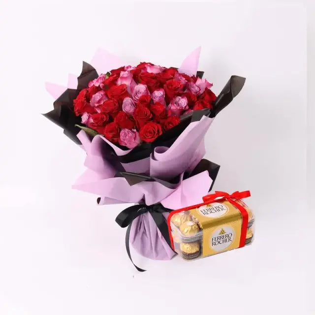 For My Queen Bouquet and Ferrero Rocher 200gmChocolate & Confectionery200gm Ferrero Rocher 31 Red Roses 20 Purple Roses Arranged in a Black and Purple Wrapping Black Ribbon Bow