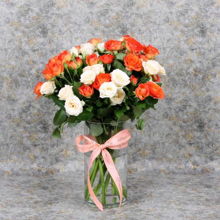 Fantastic 11 Baby Roses In VaseChocolate & Confectionery6 Stems Orange Baby Roses, 5 Stems Peach Baby Roses, Arranged in Cylinder Glass Vase - 10x20cm, Tied with Peach Color Ribbon.
