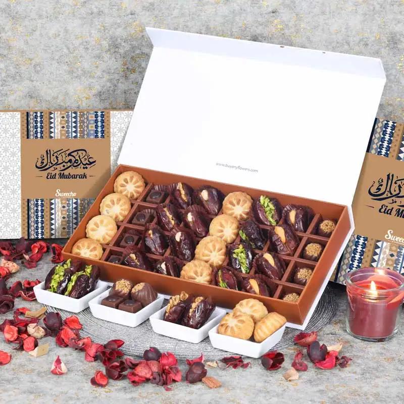 Eid Stuffed Dates Mamoul And Chocolates By Sweecho 32 Pcs BlueChocolate & ConfectioneryProduct Description Assorted Stuffed Dates, Mamoul and Chocolates Flavors - Pistachio, Cashew and Walnut, Coffee and Biscoff Quantity - 32 Pcs Arranged in a Beautiful E