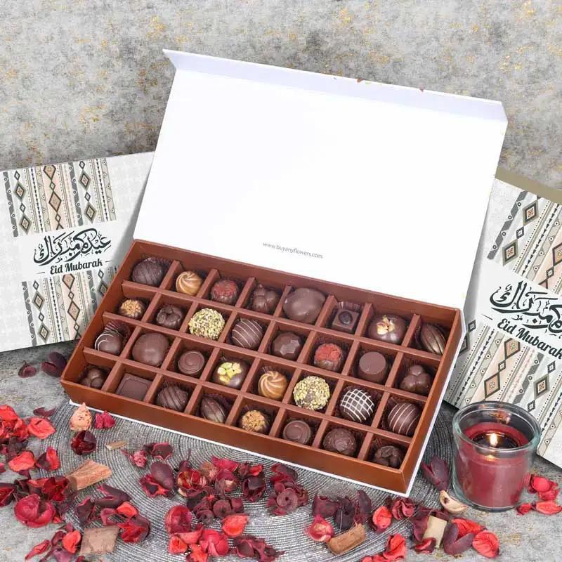 Eid Premium Chocolates By Sweecho 32 Pcs PeachChocolate & ConfectioneryProduct Description Brand - Sweecho Type - Milk Chocolate Quantity - 32 Pcs Flavors - Pistachio, Coffee, Hazelnut, Salted Caramel, Cinnamon Etc Allergens - Nuts and Milk Arranged in a