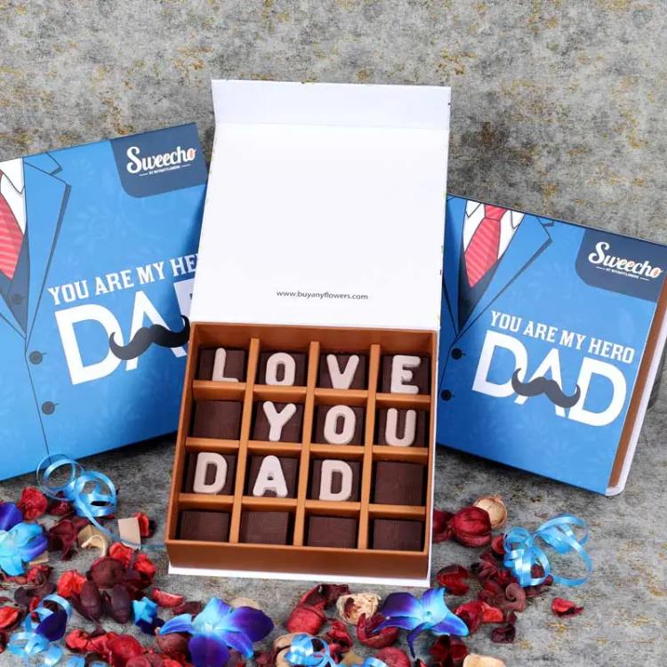 Love You Dad Chocolates 16 Pcs By SweechoChocolate & ConfectioneryBrand - Sweecho, Text - Love You Dad, Type - Milk Chocolate, Quantity - 16 Pcs, Marble Chocolate Letters, Assorted Flavors - Pistachio, Cheesecake, Lotus, Hazelnut, Coffee, Cornflakes and M