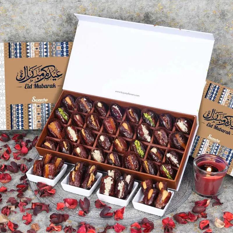 Eid Stuffed Dates By Sweecho 32 Pcs BlueChocolate & ConfectioneryProduct Description Assorted Stuffed Dates Flavors - Pistachio, Orange Peel, Cashew, Walnut and Hazelnut Quantity - 32 Pcs Arranged in a Beautiful Eid Gift Box