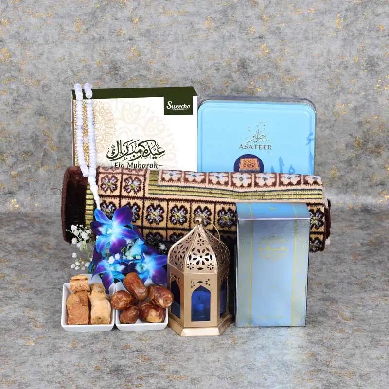 Eid Blessings Hamper BlueChocolate & ConfectioneryProduct Description 1 Prayer Mat Assorted Color 1 Prayer Beads Assorted Color Assorted Stuffed Dates Box 16 Pcs By Sweecho Premium Baklawa 375gm Rasasi or Swiss Arabia Oud Oil Assorted Color 1 Lantern Deco