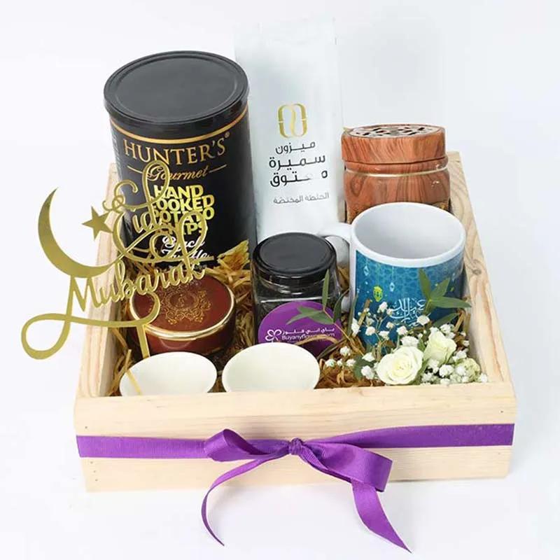 Aromatic Eid Kahwa And Coffee HamperGifts and HampersProduct Description Arabic Coffee 100gm Eid Mubarak Coffee Mug Medjool Dates in Jar 100gm 1 Bakhoor 1 Bakhoor Burner 2 Small Cups Hunters Hand Cooked Chips 150gm 1 Small Bunch of 1 Stem Baby Rose and Gy