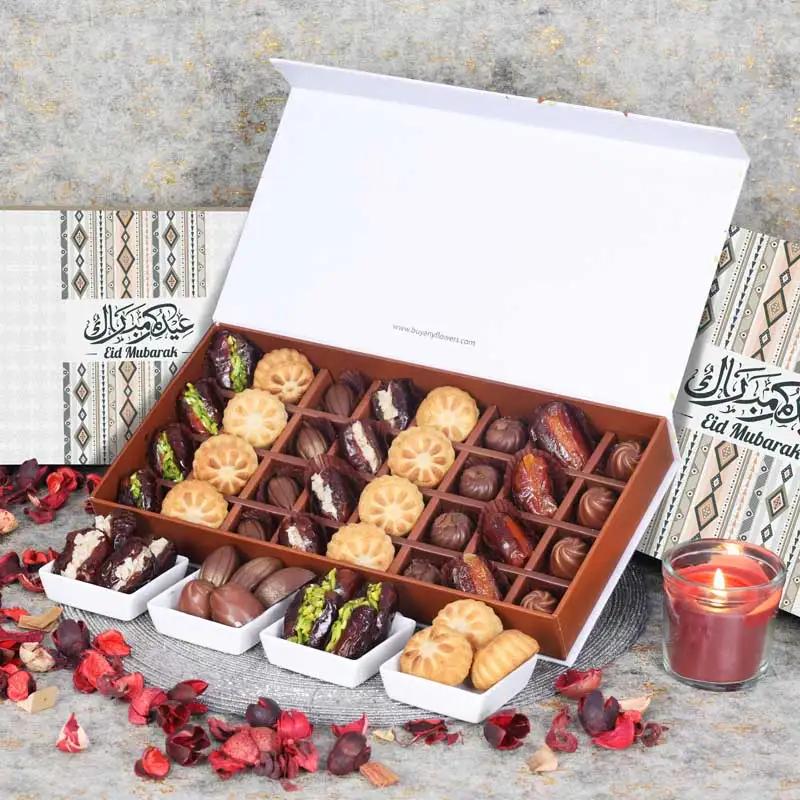 Eid Stuffed Dates Mamoul And Chocolates By Sweecho 32 Pcs PeachChocolate & ConfectioneryProduct Description Assorted Stuffed Dates, Mamoul and Chocolates Flavors - Pistachio, Orange Peel and Almond, Cinnamon and Biscoff Quantity - 32 Pcs Arranged in a Bea