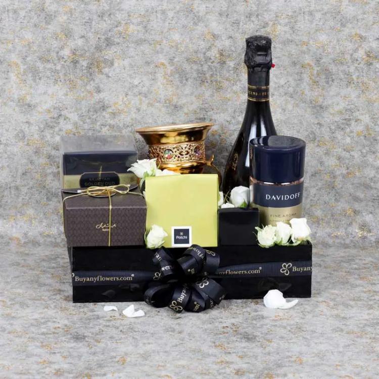 Premium Gift Hamper For HimChocolate & ConfectioneryPremium Bateel Organic Date 250gm, Deluxe Patchi Chocolate 100gm, YBY Premium Sparkling Juice, Davidoff Coffee 100gm, Swiss Arabia Bakhoor, Bakhoor Burner, Arranged in a Black Acrylic Tray - 20x30cm.
