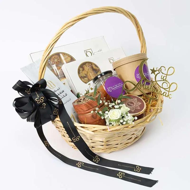 Sweetness Of Eid HamperGifts and HampersProduct Description Medjool Dates in Box 200gm Dates Mamoul 330gm Baklawa 150gm Chilli Cashews in Jar 100gm 1 Bakhoor 1 Bakhoor Burner 1 Arabic Coffee 100gm 1 Eid Mubarak Topper Arranged in a Handle Basket with Ribb