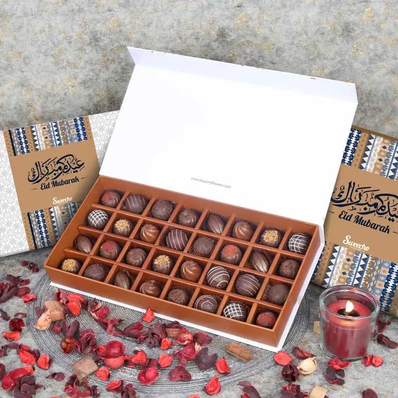 Eid Premium Chocolates By Sweecho 32 Pcs BlueChocolate & ConfectioneryProduct Description Brand - Sweecho Type - Milk Chocolate Quantity - 32 Pcs Flavors - Pistachio, Coffee, Hazelnut, Salted Caramel, Cinnamon Etc Allergens - Nuts and Milk Arranged in a B