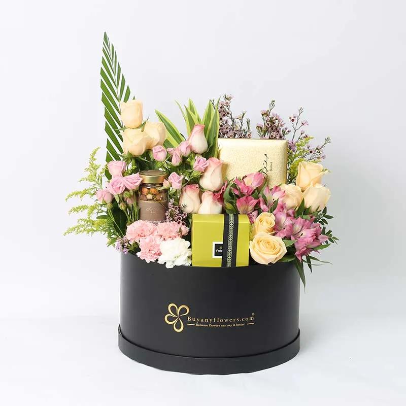 Pastel Bateel And Patchi Floral HamperGifts and HampersProduct Description Bateel Premium Stuffed Dates 450gm Bateel Premium Mixed Arabia Nuts 160gm Patchi Deluxe Chocolates 250gm 8 Peach Roses 4 Dual Pink Roses 3 Stems Pink Baby Roses 3 Stems Pink Alstro