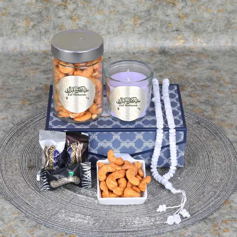 Eid Meditating Aroma HamperGifts and HampersProduct Description 1 Prayer Beads Chocolate Coated Dates with Nuts 5 Pcs Chilli Cashews in a Jar 150gm 1 Scented Jar Candle Arranged in a Gift Box